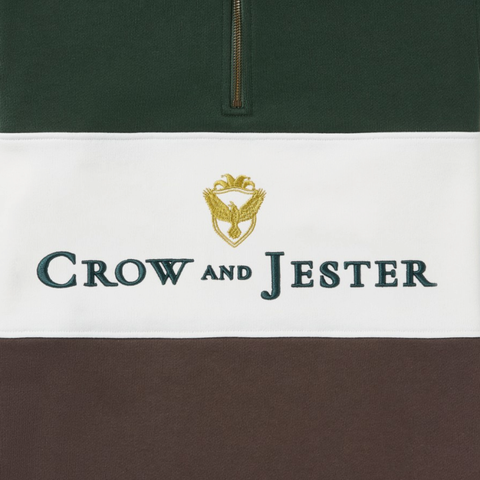 Embroidered gold crest and Crow & Jester wordmark